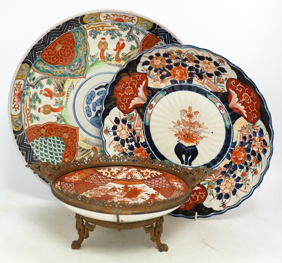 Five Japanese Imari dishes and a Kutani gilt metal mounted bowl, Meiji period, largest 35cm. Condition - poor to fair
